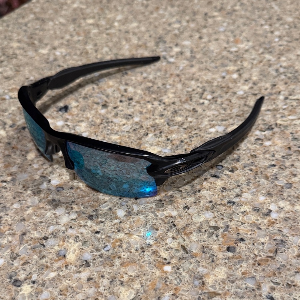 Oakley Glossy Black Sunglasses with Reflective Blue Lenses